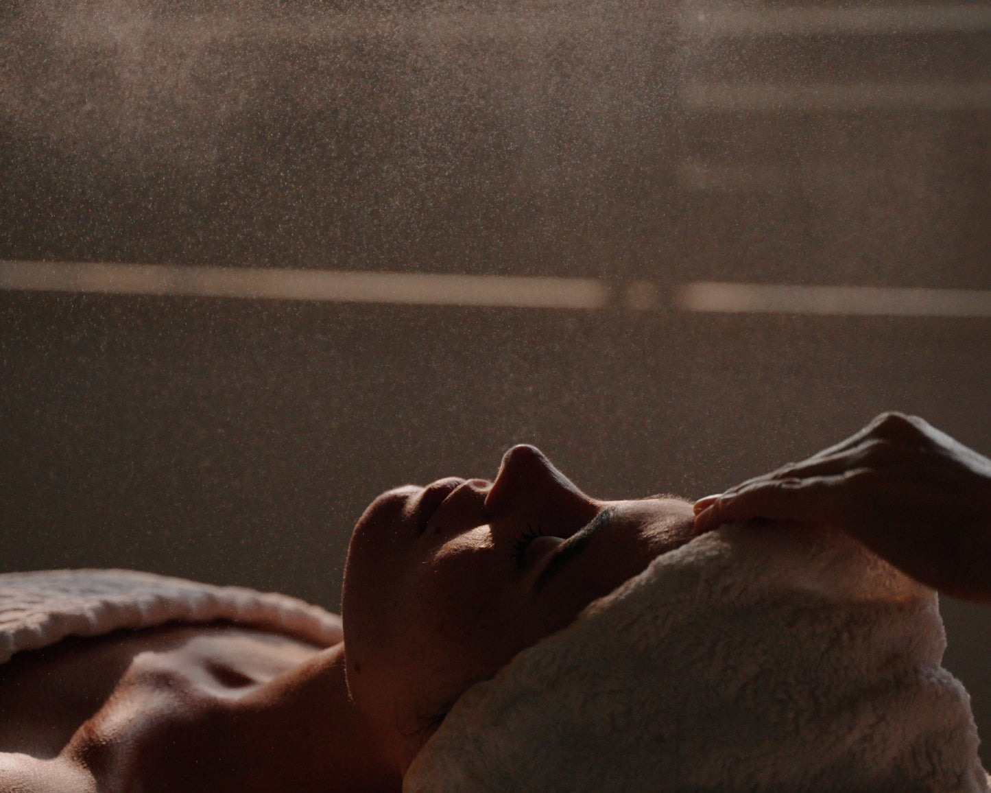 Woman laying experiencing holistic facial at Earth Bud studio