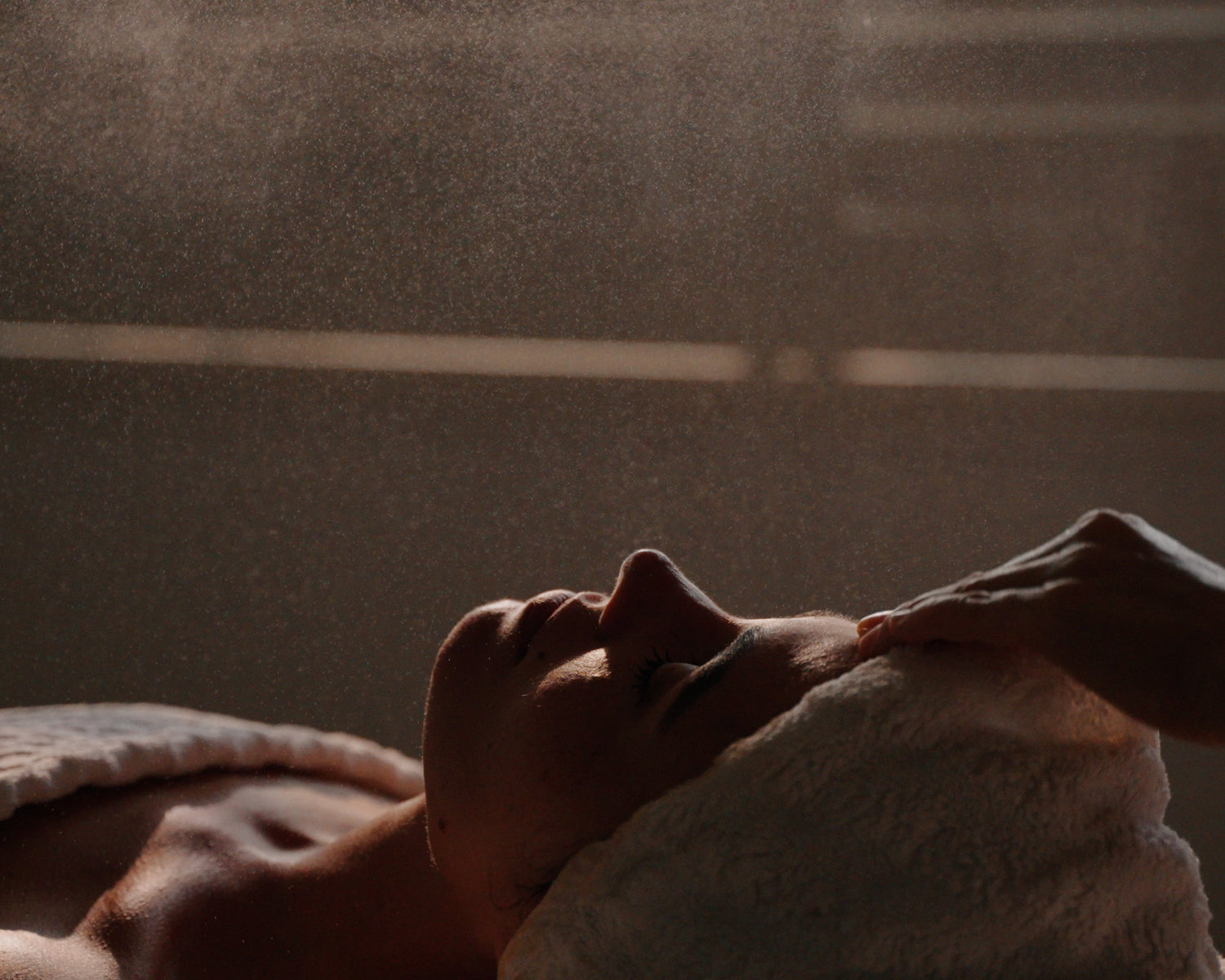 Woman laying experiencing holistic facial at Earth Bud studio